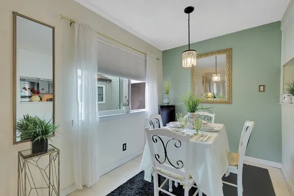 a dining room with furniture and window