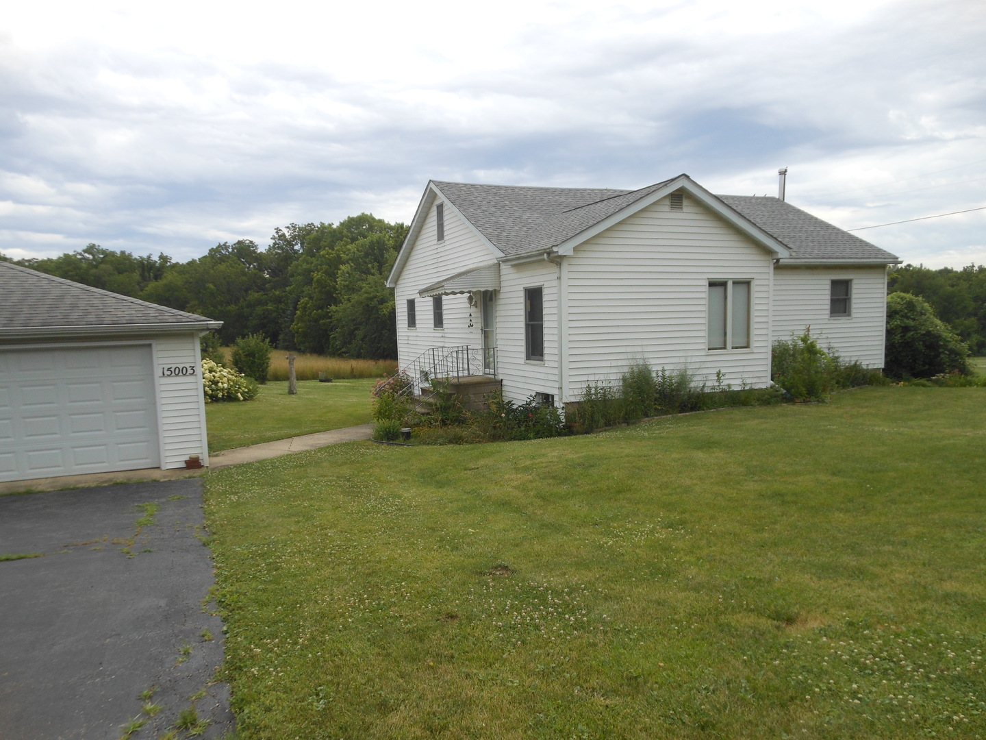 15003 High Road Lockport, IL 60441 - Photo 2 of 30 a view of a house with a yard and potted plants