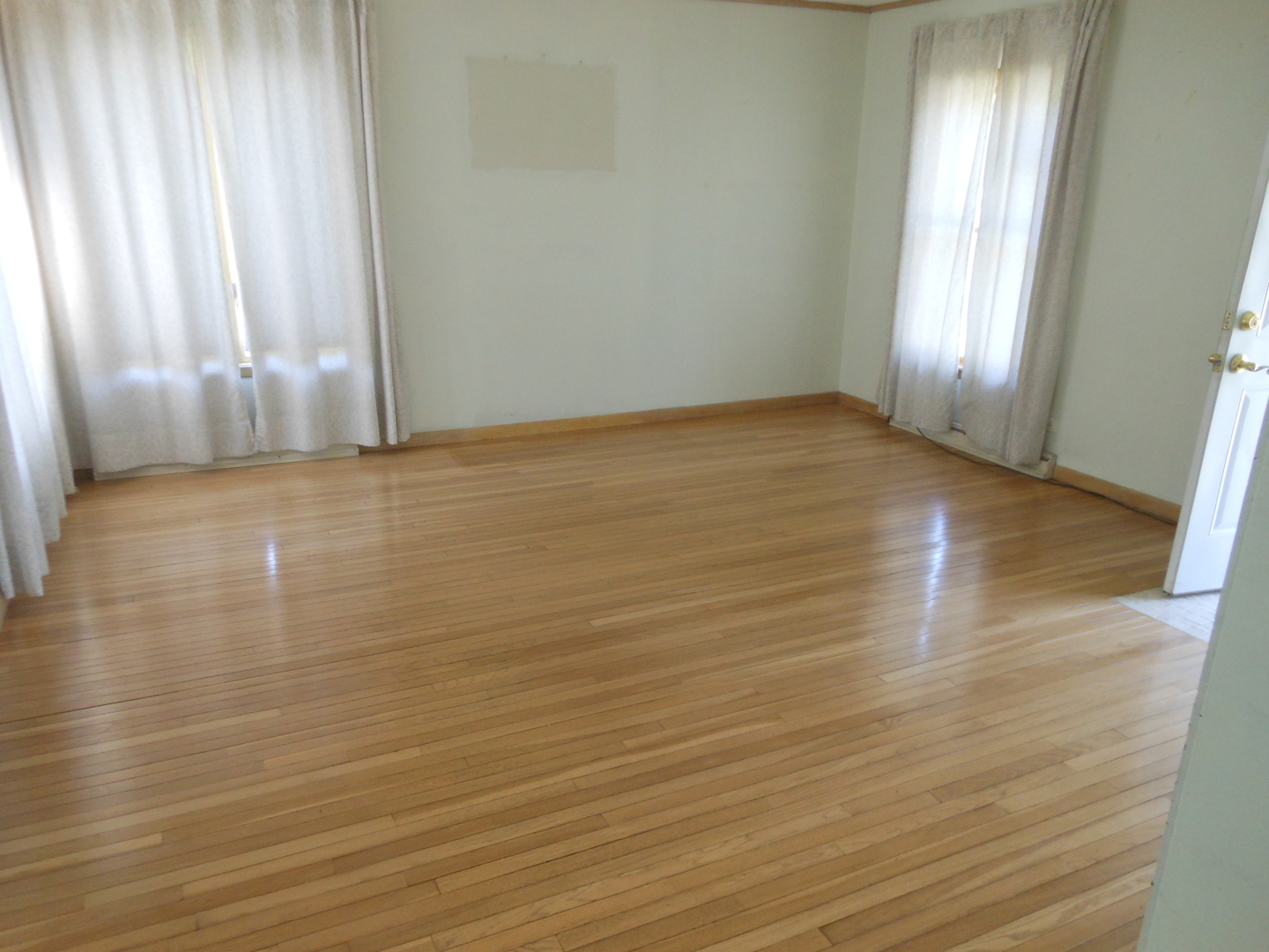 15003 High Road Lockport, IL 60441 - Photo 8 of 30 a view of an empty room with wooden floor and a window