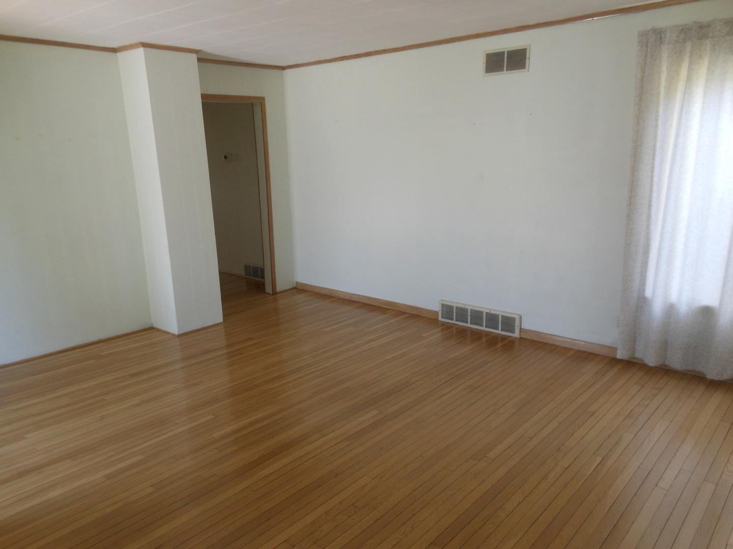 15003 High Road Lockport, IL 60441 - Photo 9 of 30 an empty room with wooden floor and windows