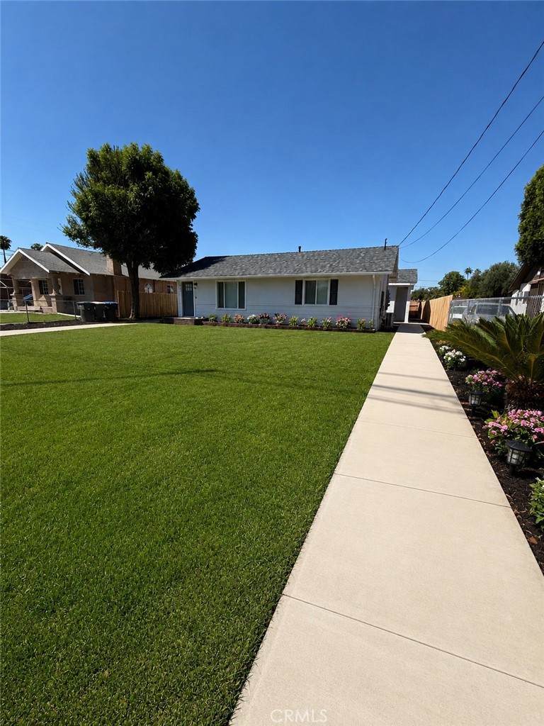 3460 Washington Street Riverside, CA 92506 - Photo 3 of 32 Grass and flowers is AI, however lawn has been newly soded