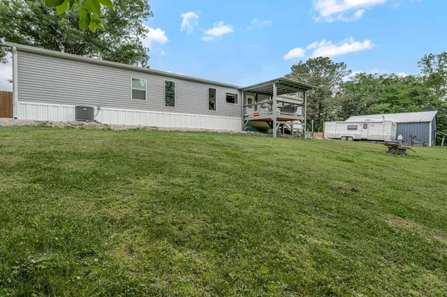 a view of a garage with a bike and car