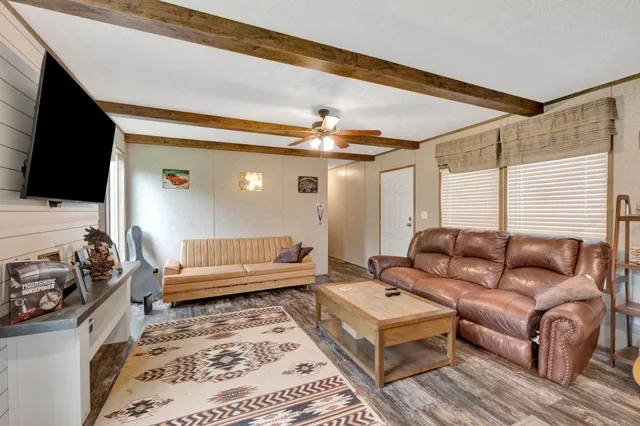 a kitchen with stainless steel appliances granite countertop a refrigerator stove microwave and sink