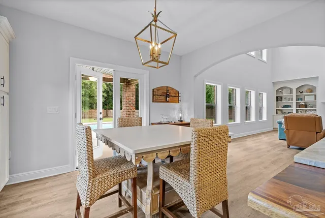 a kitchen with cabinets and window