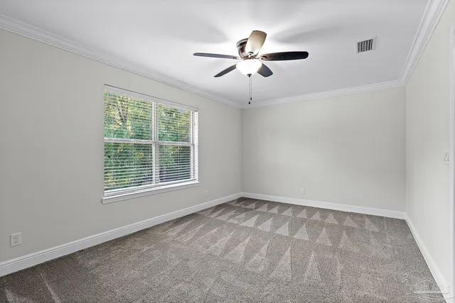 a view of a hallway with wooden floor and cabinet