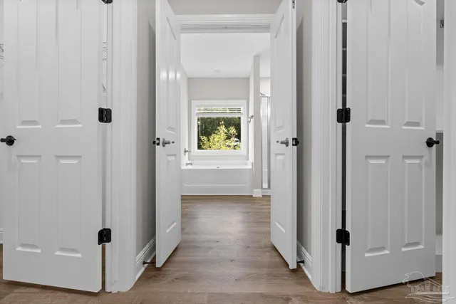 a bathroom with a glass shower door