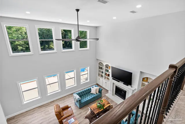 a bathroom with a double vanity sink a toilet and a bathtub
