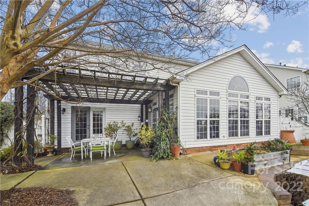 5533 Alexandrite Way Fort Mill, SC 29708 - Photo 19 of 27 a view of a patio with table and chairs and potted plants