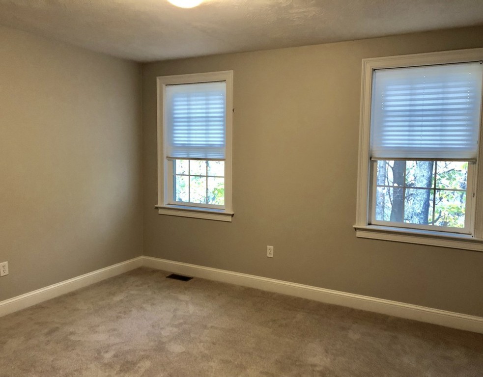 120 Summer Road, Unit 120 Boxborough, MA 01719 - Photo 5 of 6 an empty room with a window