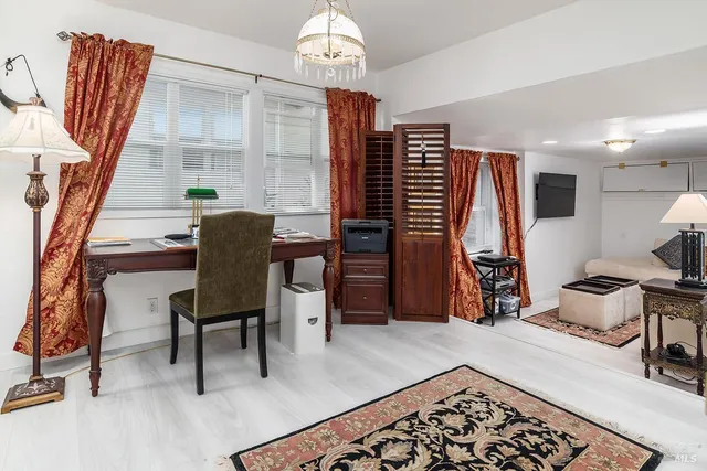 a bedroom with furniture and a window