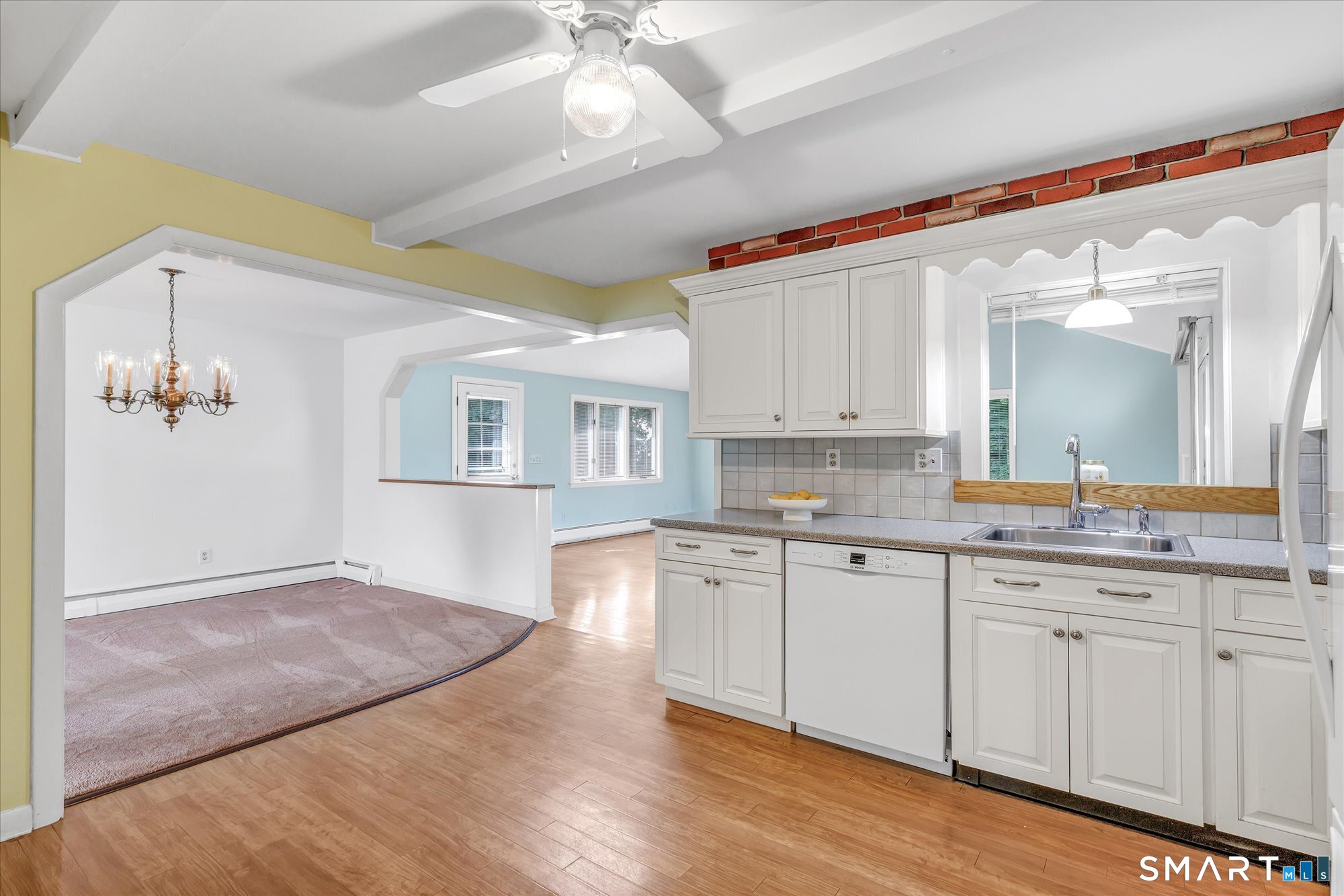 94 Ascolese Road Trumbull, CT 06611 - Photo 31 of 34 Kitchen with open floor plan to dining room, living room and huge family room