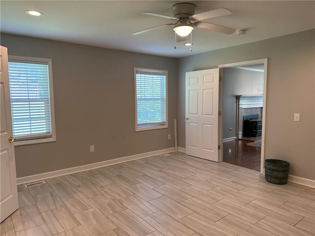 241 Olde Quarry Road Graham, NC 27253 - Photo 15 of 30 wooden floor in an empty room with a window