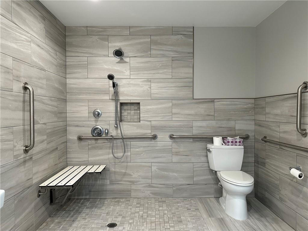 241 Olde Quarry Road Graham, NC 27253 - Photo 18 of 30 a bathroom with a toilet and a shower