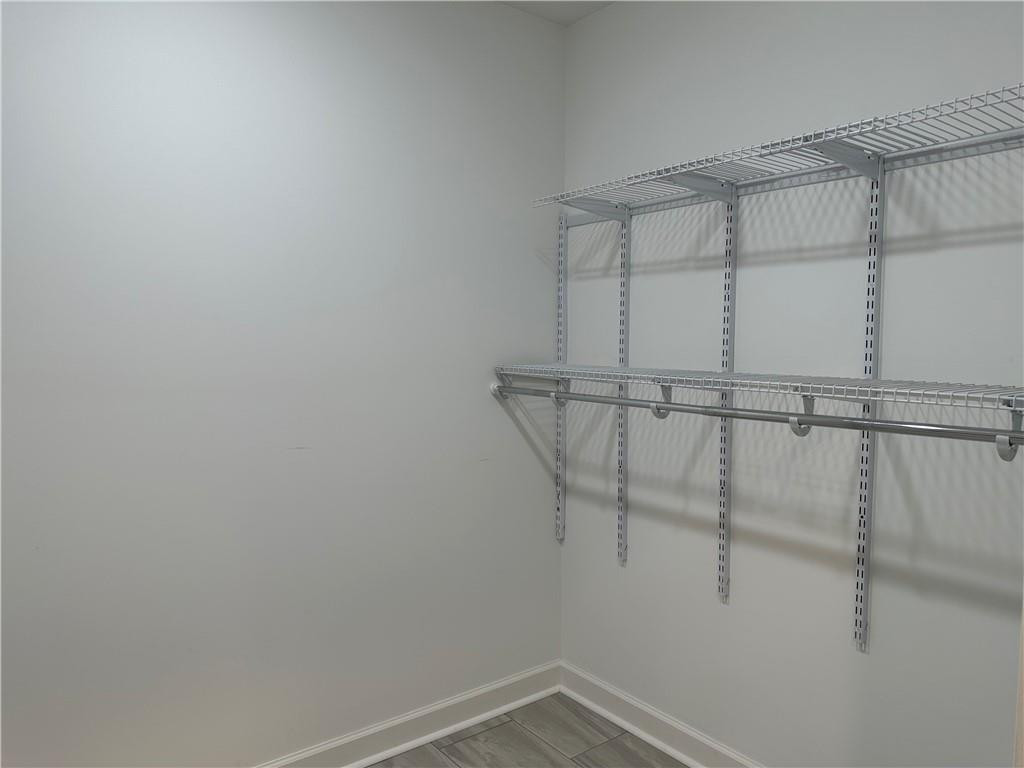 241 Olde Quarry Road Graham, NC 27253 - Photo 19 of 30 a view of a room with racks on the wall