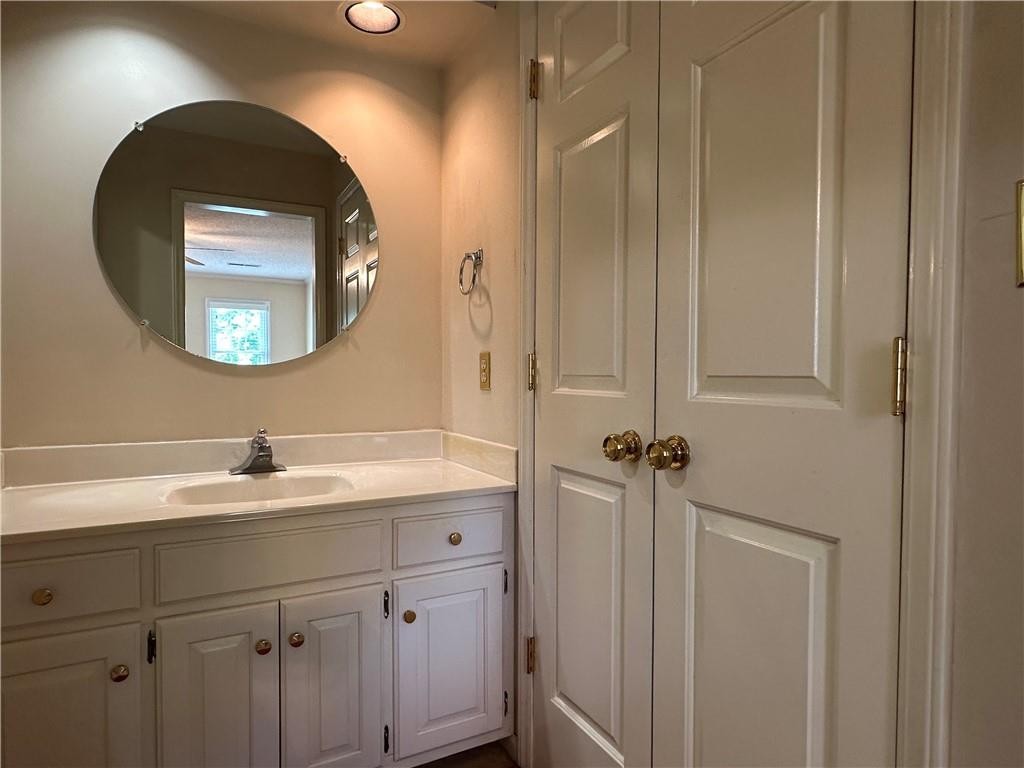 241 Olde Quarry Road Graham, NC 27253 - Photo 21 of 30 a bathroom with a sink and a mirror