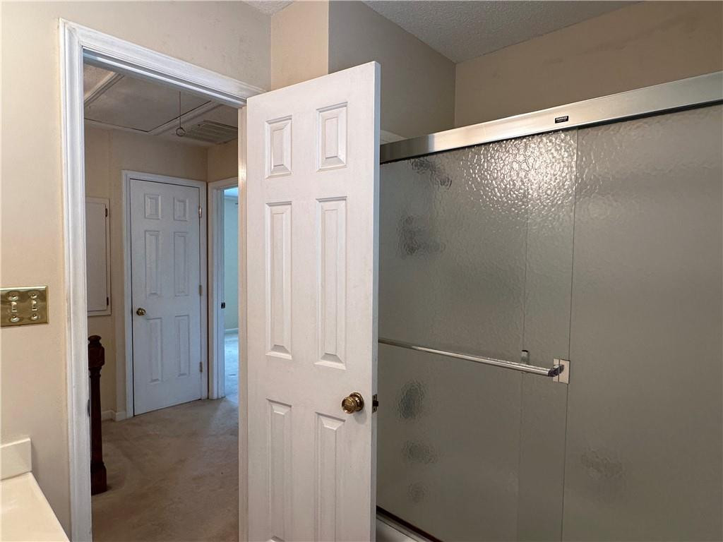 241 Olde Quarry Road Graham, NC 27253 - Photo 24 of 30 a bathroom with a glass shower door