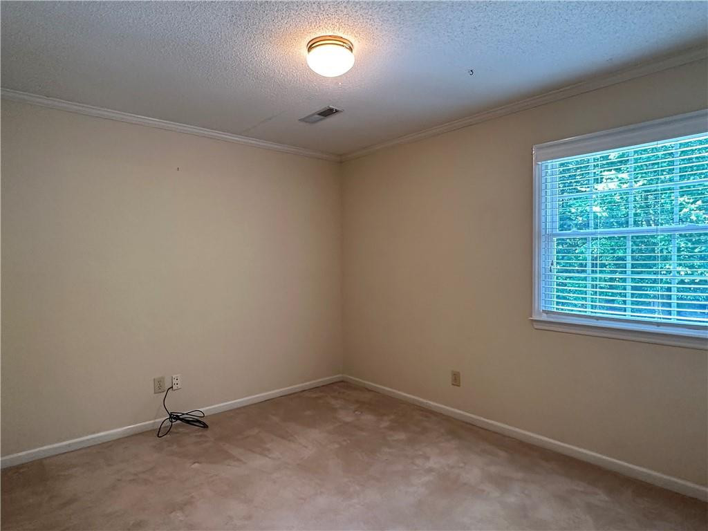 241 Olde Quarry Road Graham, NC 27253 - Photo 26 of 30 an empty room with a window