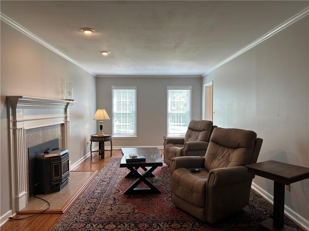 241 Olde Quarry Road Graham, NC 27253 - Photo 6 of 30 a living room with furniture a flat screen tv and a window