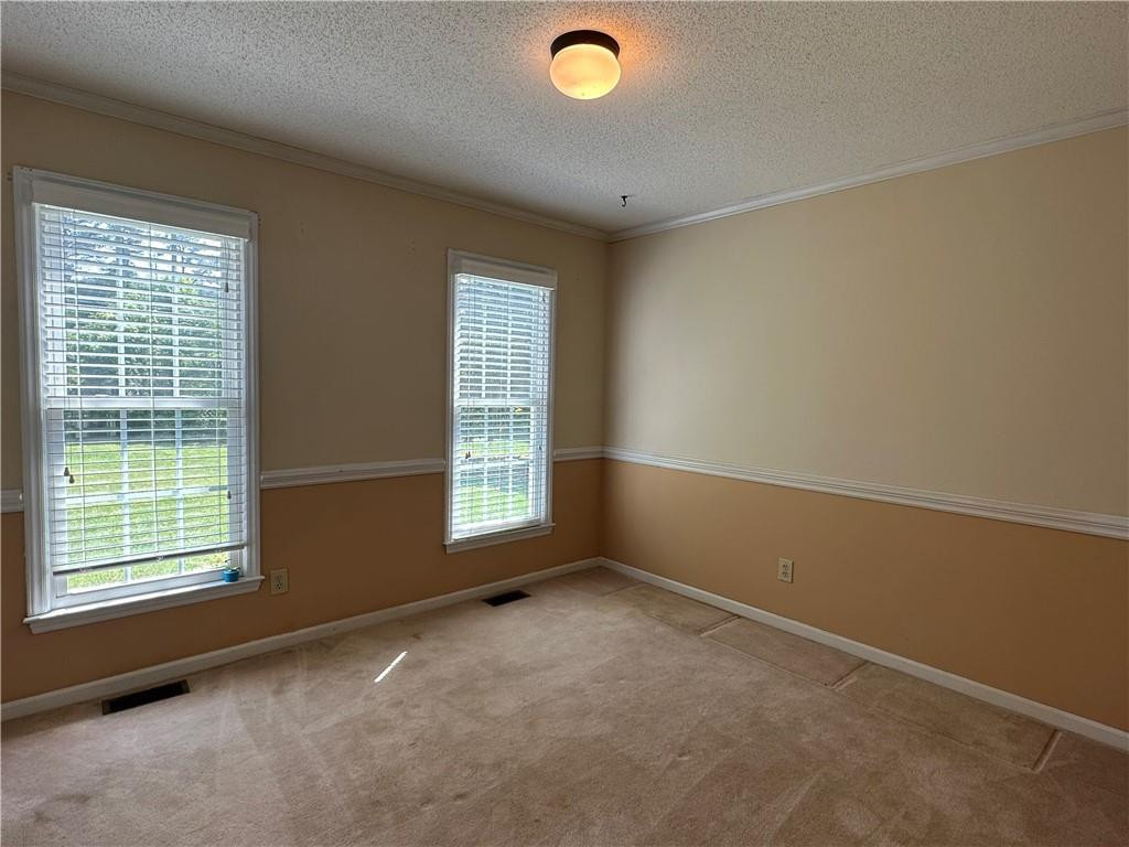 241 Olde Quarry Road Graham, NC 27253 - Photo 8 of 30 an empty room with windows