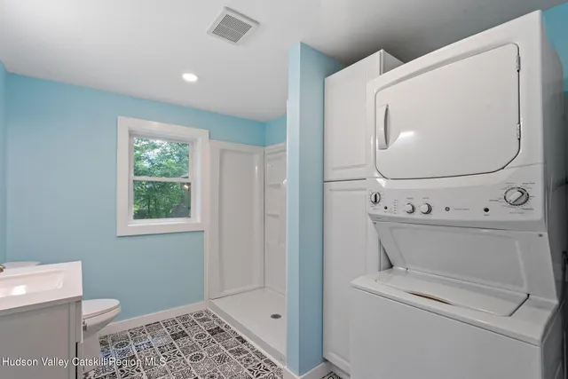 a bathroom with a toilet and a vanity