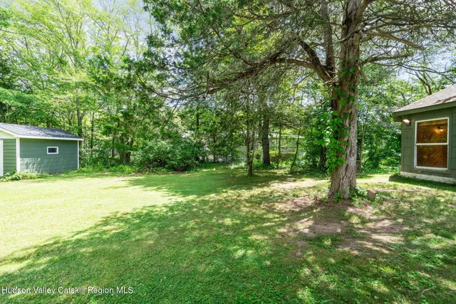 a backyard of a house with lots of green space