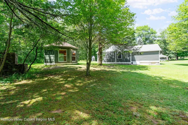 a house view with a sitting space and garden view