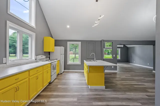 a view of kitchen with wooden floor