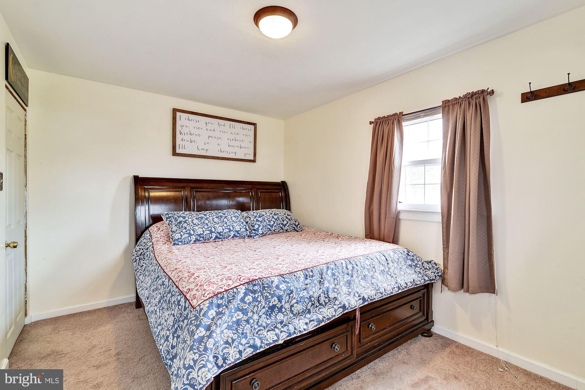 16 Stanger Road Bridgeton, NJ 08302 - Photo 23 of 34 a bedroom with a bed and painting on the wall