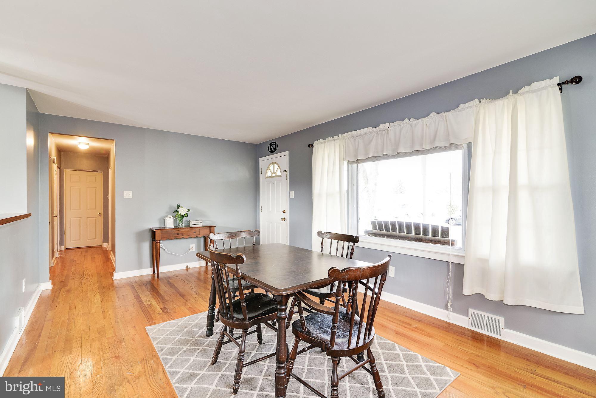 16 Stanger Road Bridgeton, NJ 08302 - Photo 9 of 34 a view of a dining room with furniture and wooden floor