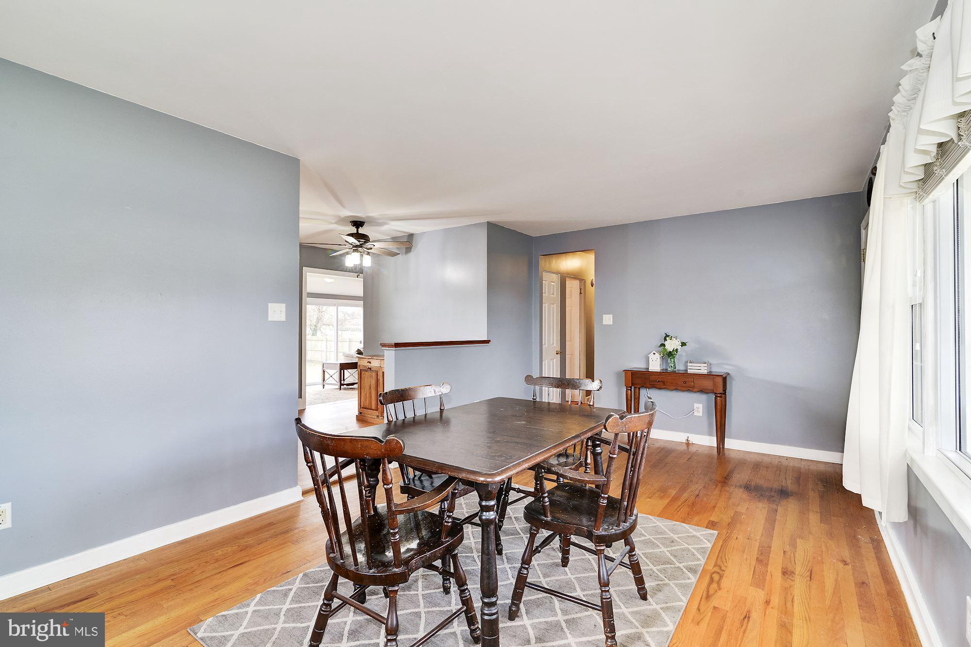 16 Stanger Road Bridgeton, NJ 08302 - Photo 10 of 34 a view of a dining room with furniture and wooden floor