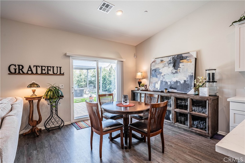 28340 Memory Lane Winchester, CA 92596 - Photo 15 of 39 a view of a dining room with furniture window and wooden floor