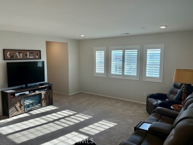28340 Memory Lane Winchester, CA 92596 - Photo 21 of 39 a living room with furniture and a flat screen tv