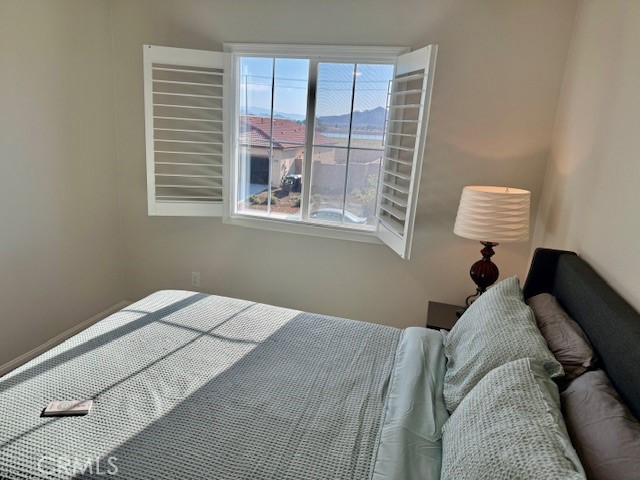 28340 Memory Lane Winchester, CA 92596 - Photo 25 of 39 a bedroom with a bed and a window