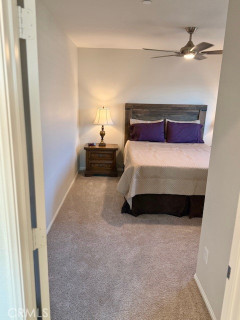 28340 Memory Lane Winchester, CA 92596 - Photo 28 of 39 a bedroom with a bed and a ceiling fan