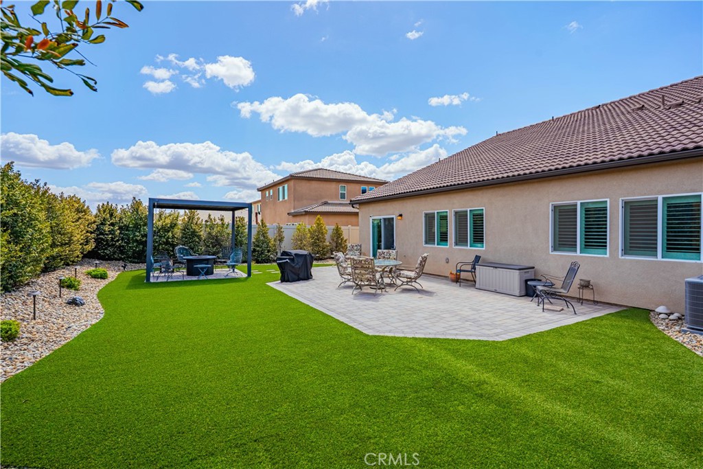 28340 Memory Lane Winchester, CA 92596 - Photo 32 of 39 a view of a house with backyard and sitting area