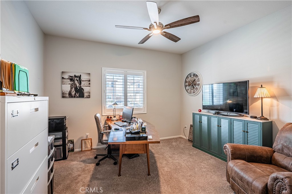 28340 Memory Lane Winchester, CA 92596 - Photo 5 of 39 a living room with furniture a flat screen tv and a window