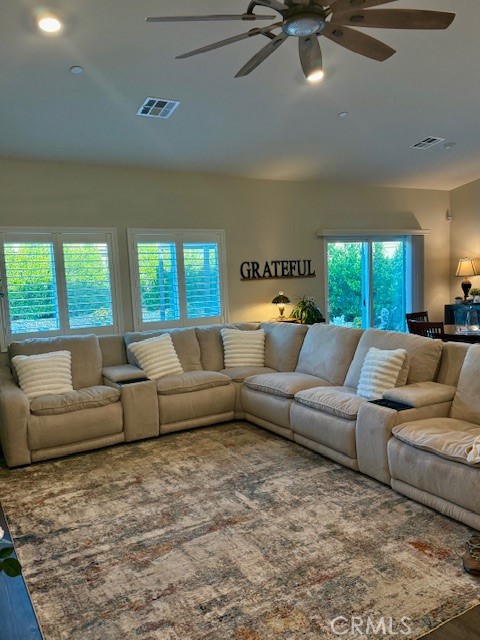 28340 Memory Lane Winchester, CA 92596 - Photo 9 of 39 a living room with furniture and a large window