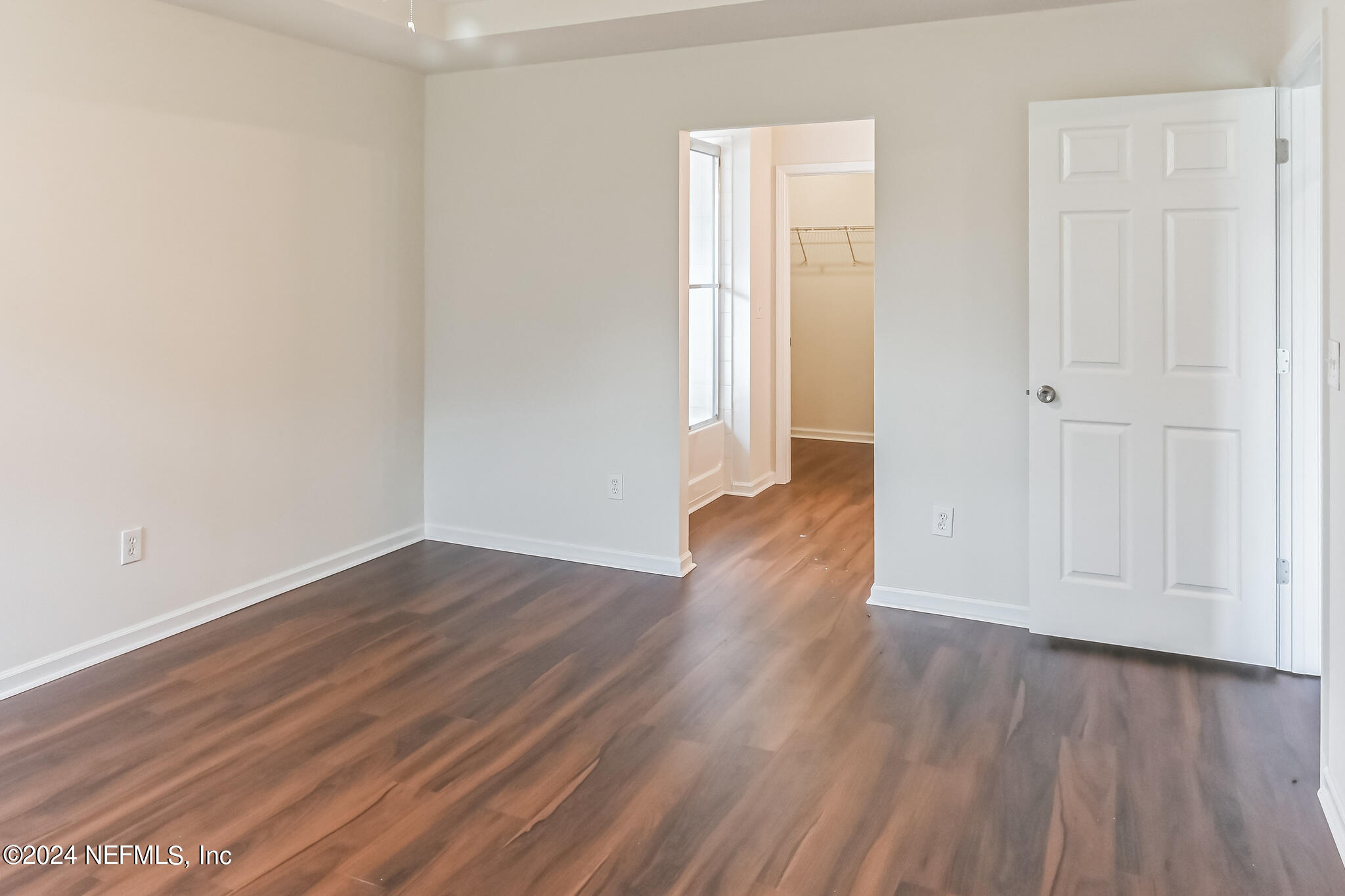 15234 Bareback Drive Jacksonville, FL 32234 - Photo 14 of 21 a view of a room with wooden floor and closet area