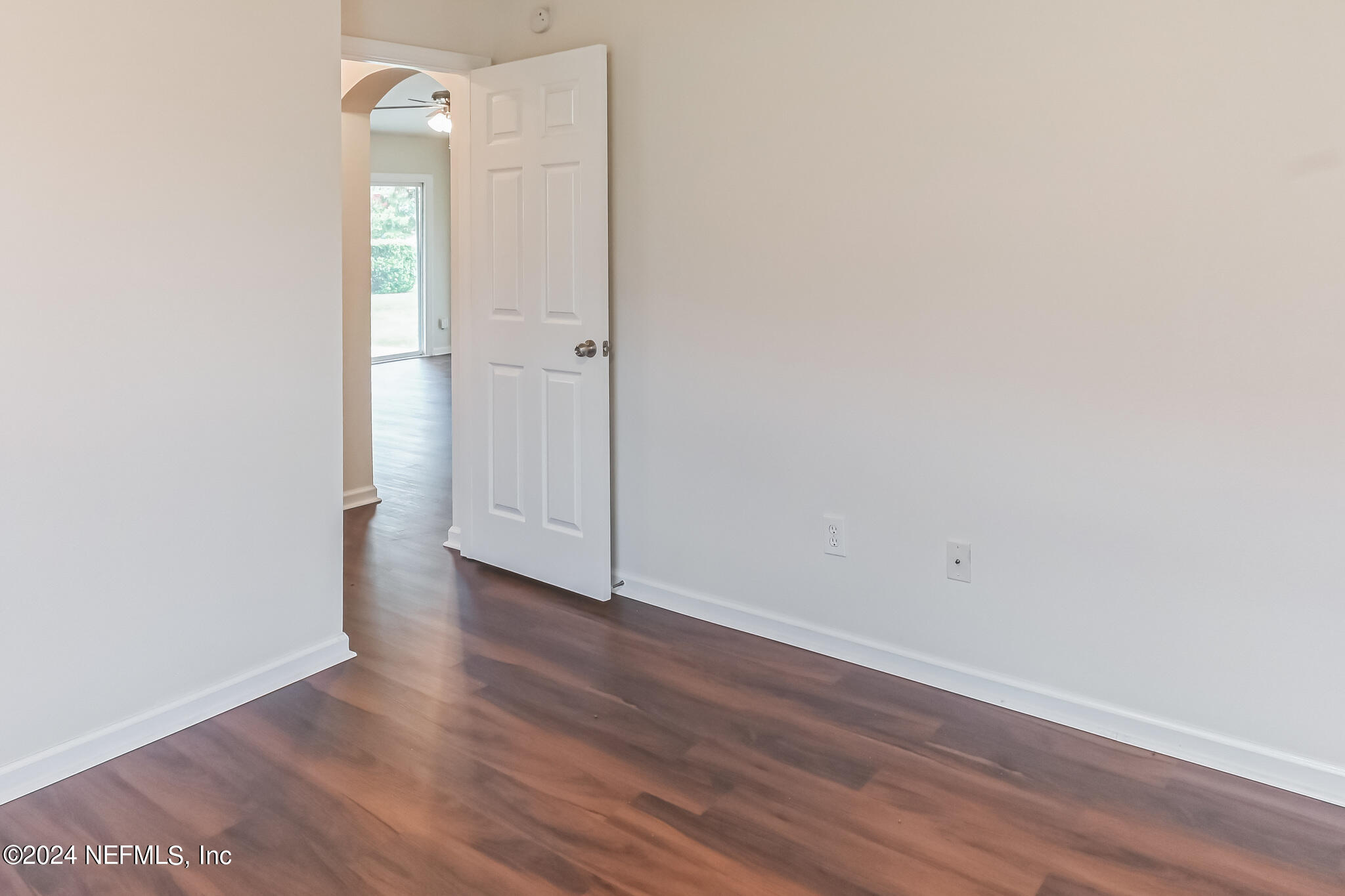 15234 Bareback Drive Jacksonville, FL 32234 - Photo 15 of 21 a view of an empty room with wooden floor