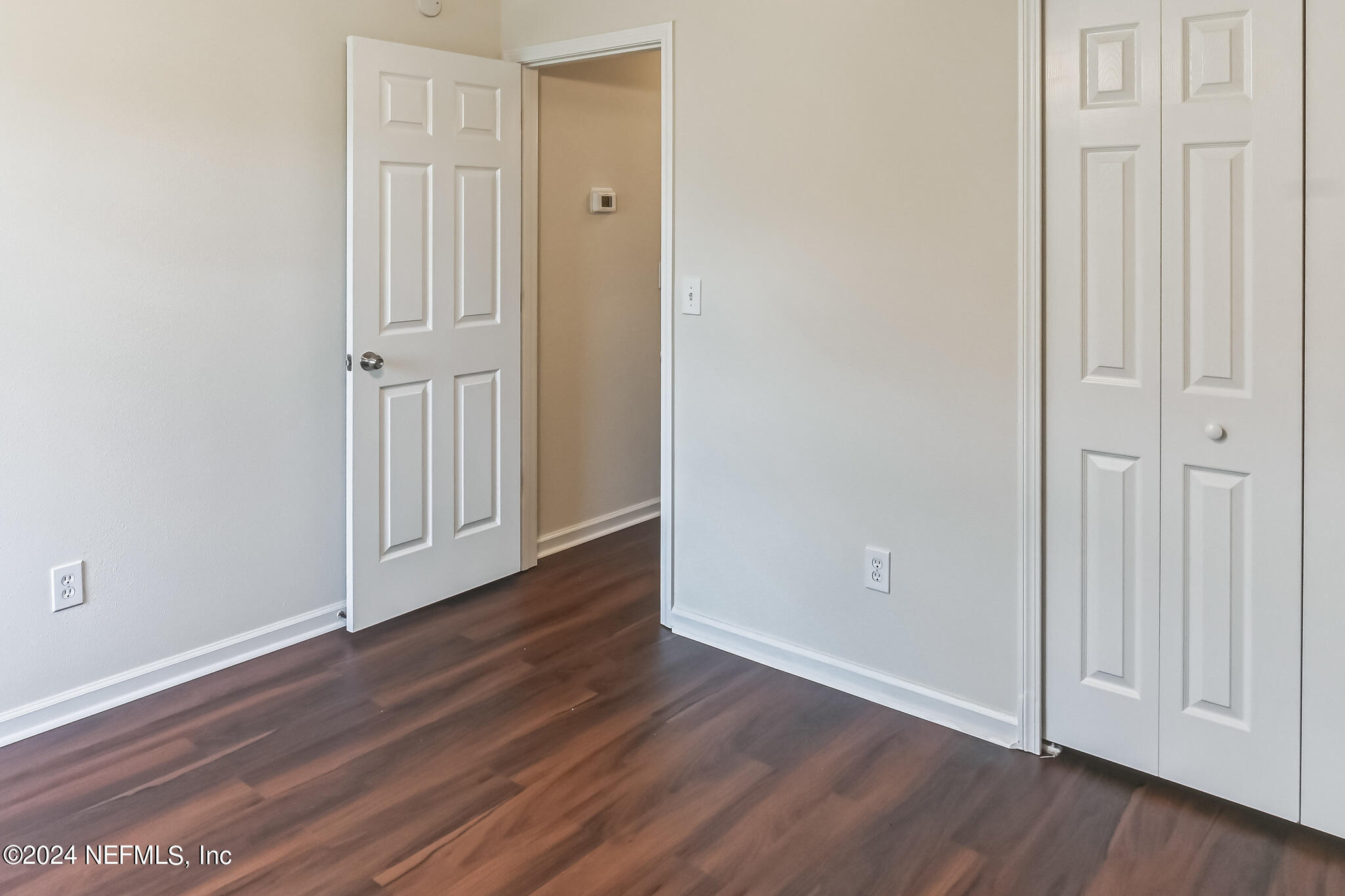 15234 Bareback Drive Jacksonville, FL 32234 - Photo 16 of 21 a view of empty room with wooden floor