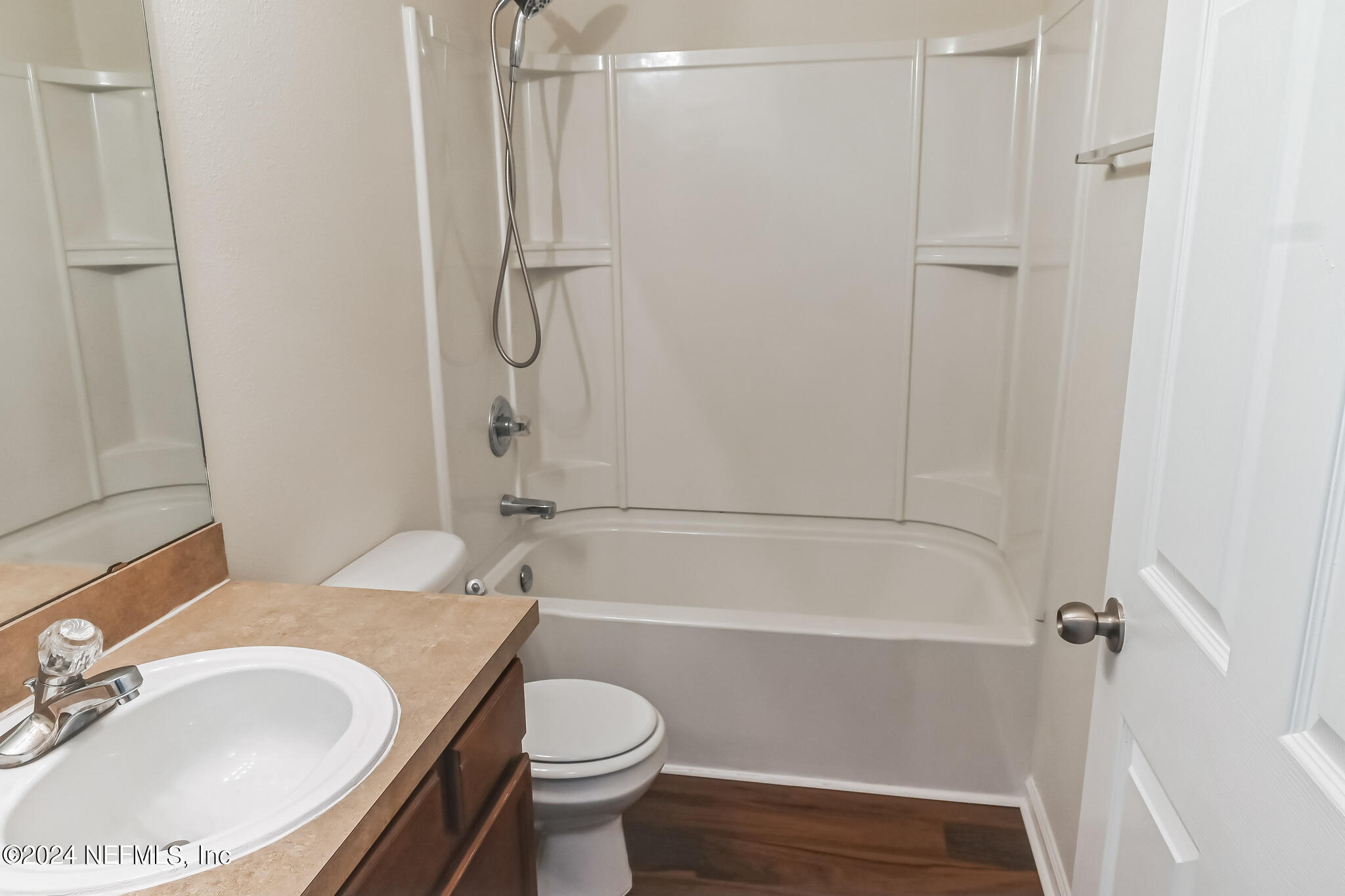 15234 Bareback Drive Jacksonville, FL 32234 - Photo 19 of 21 a bathroom with a granite countertop sink toilet and shower