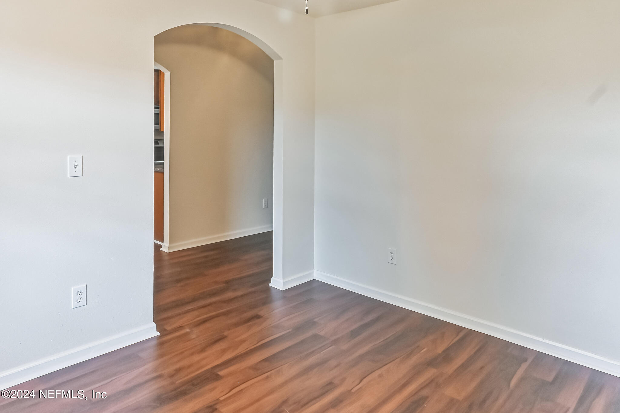 15234 Bareback Drive Jacksonville, FL 32234 - Photo 4 of 21 an empty room with wooden floor and closet