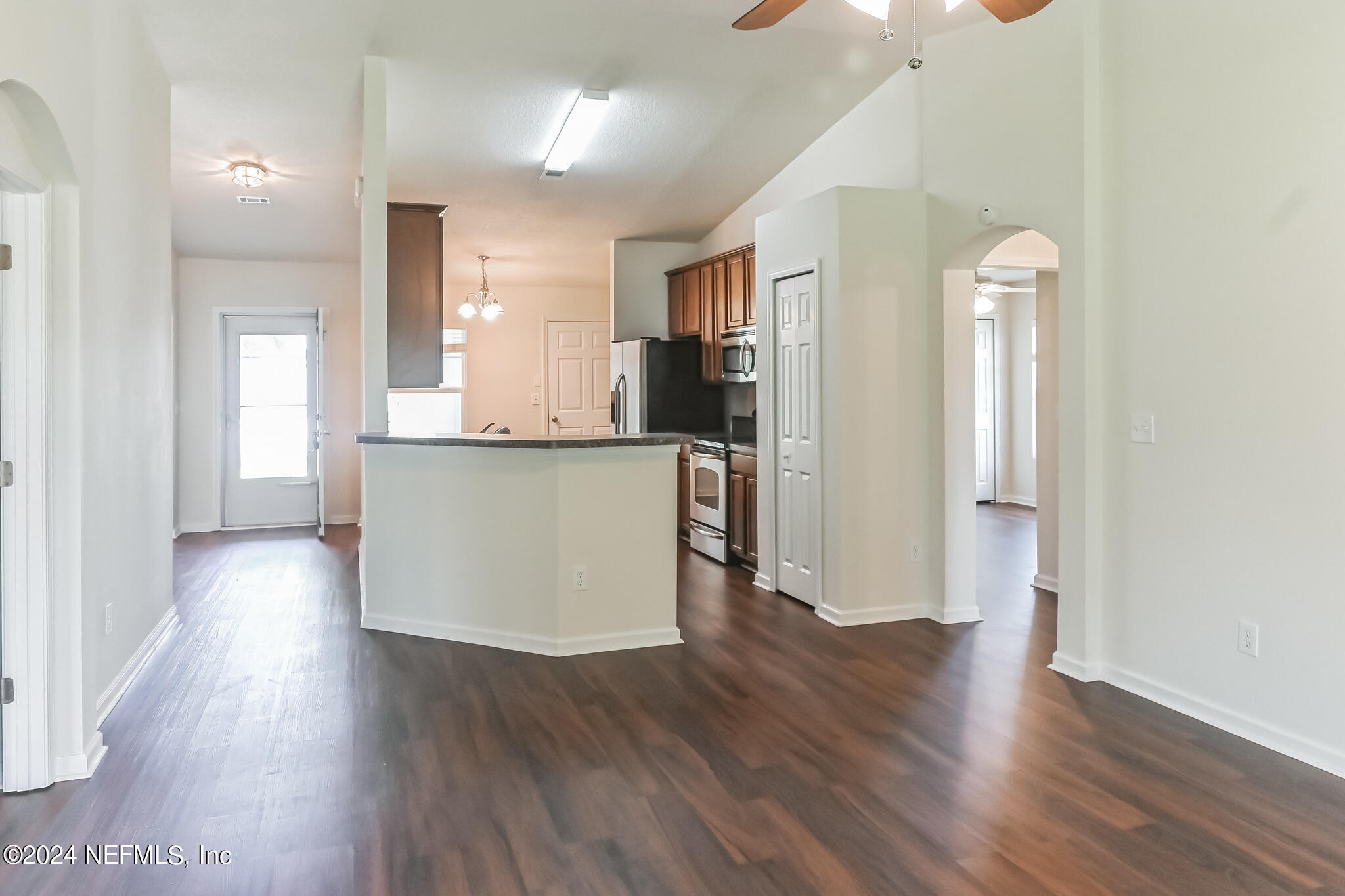 15234 Bareback Drive Jacksonville, FL 32234 - Photo 5 of 21 a view of a kitchen with wooden floor and a window