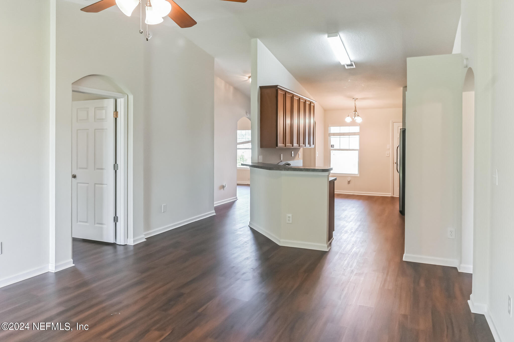 15234 Bareback Drive Jacksonville, FL 32234 - Photo 6 of 21 a view of kitchen with wooden floor and electronic appliances