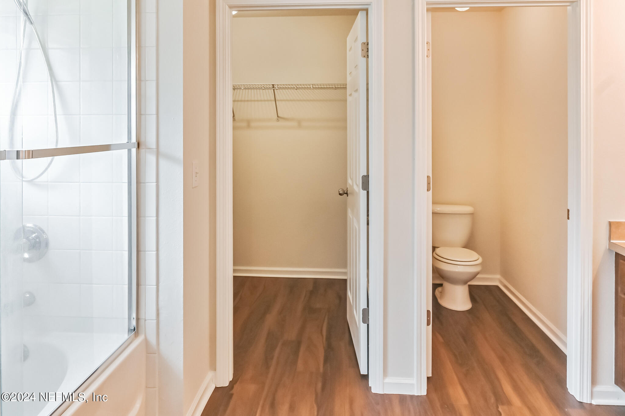 15234 Bareback Drive Jacksonville, FL 32234 - Photo 10 of 21 a view of a bathroom with a hardwood floor and a sink