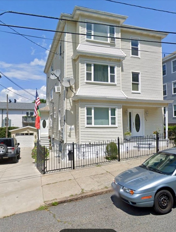 a car parked in front of a house