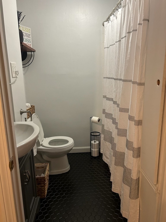 166 Bradford Avenue Fall River, MA 02721 - Photo 11 of 28 a bathroom with a sink and a toilet