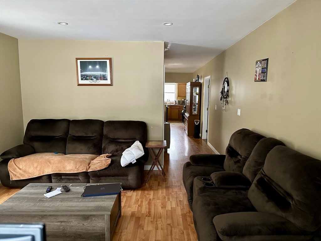 166 Bradford Avenue Fall River, MA 02721 - Photo 13 of 28 a living room with furniture and wooden floor