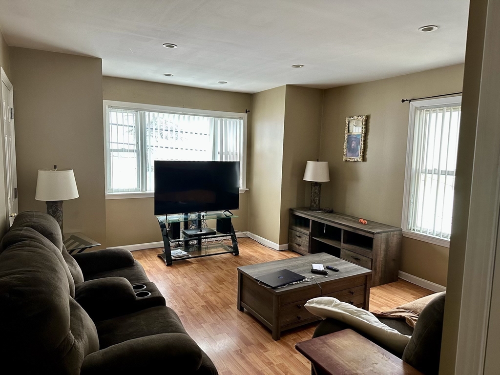 166 Bradford Avenue Fall River, MA 02721 - Photo 14 of 28 a living room with furniture and a flat screen tv