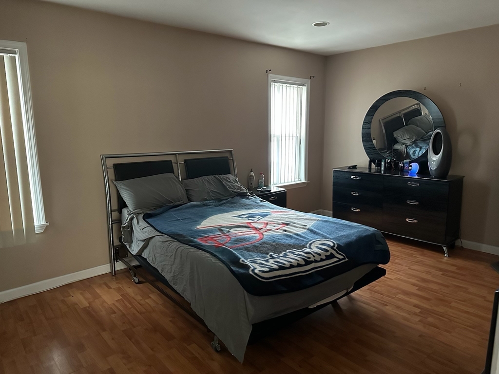 166 Bradford Avenue Fall River, MA 02721 - Photo 17 of 28 a bedroom with a bed a dresser and window